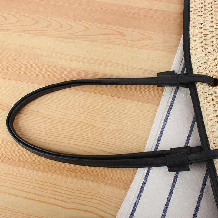 Tote bag with sophisticated compartment design and durable leather handles Bowlift