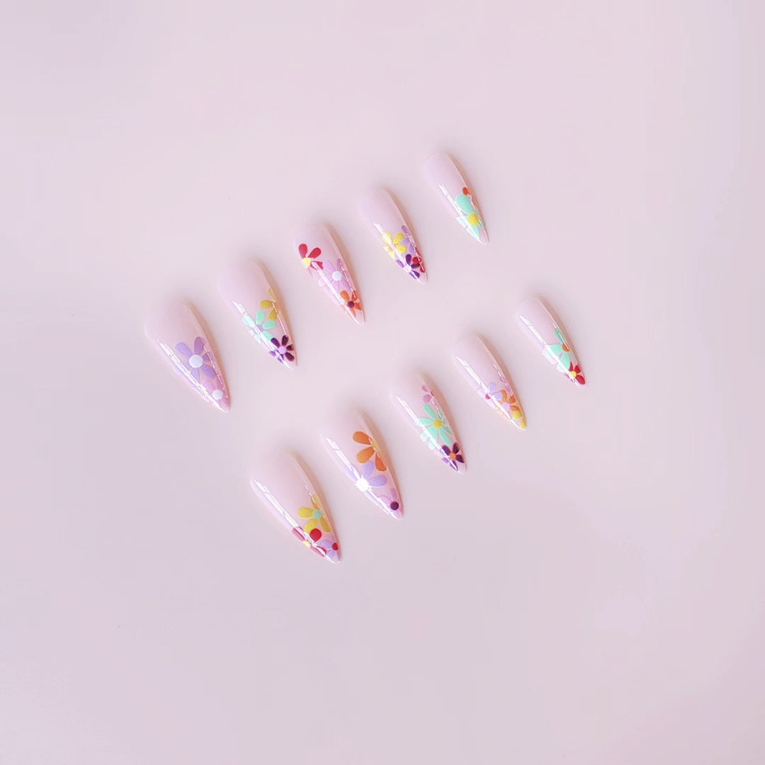 Acrylic nail set with vibrant floral designs and sharp accents Bowlift