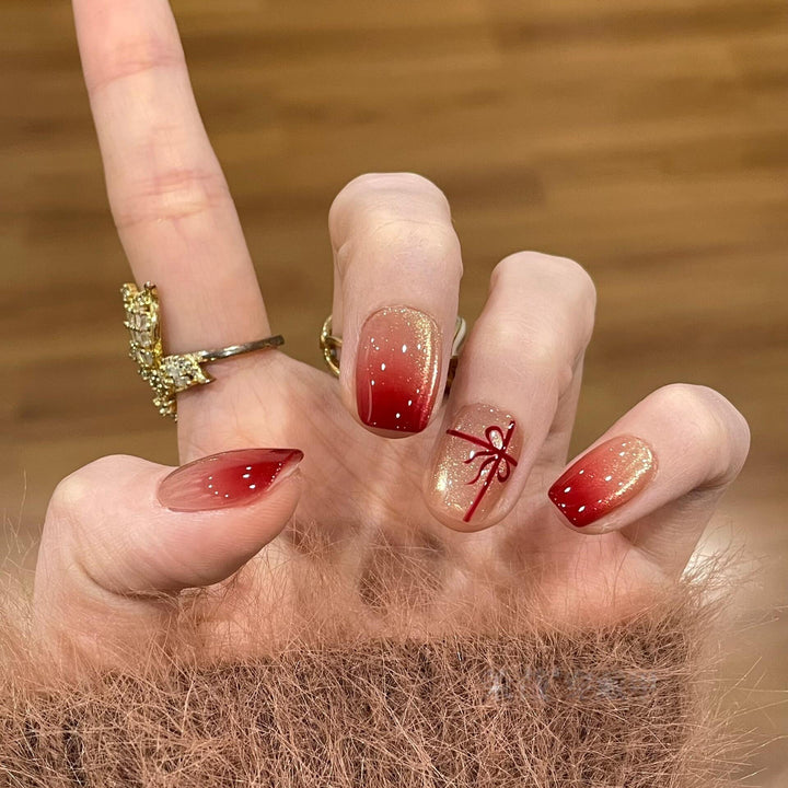 Artificial nails with festive gradient color and elegant decorations Bowlift