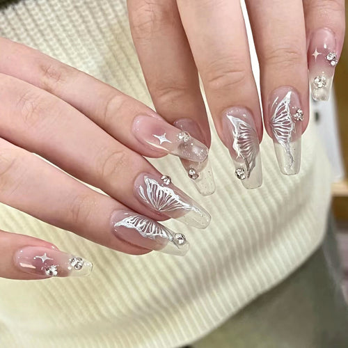 Elegant artificial nails with floral designs and glitter accents Bowlift