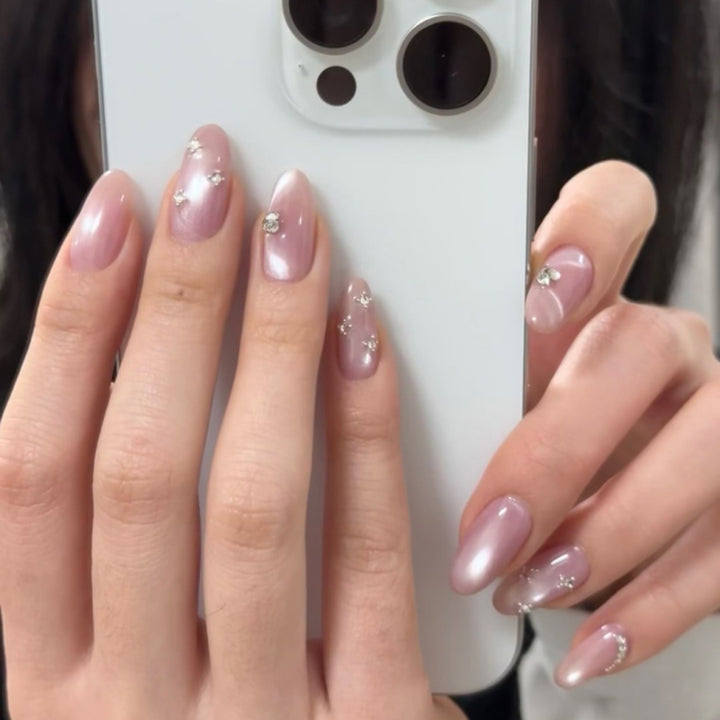 Artificial nail art with glitter embellishments Bowlift