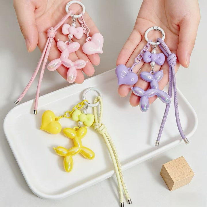 Playful keychain with heart and balloon dog Bowlift