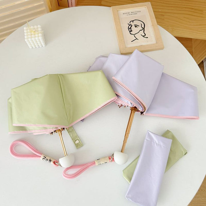 Ladies compact folding umbrella with practical handbag loop Bowlift