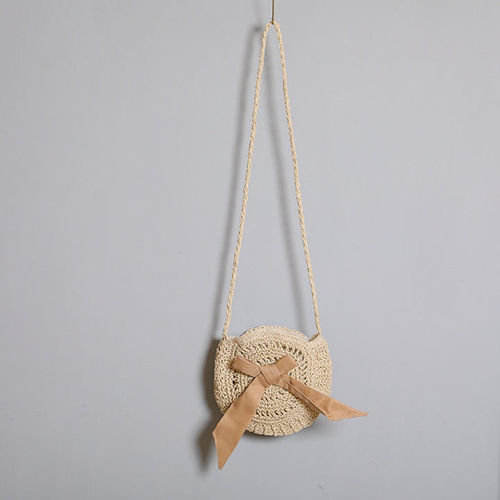 Handwoven shoulder bag with decorative bow accent Bowlift