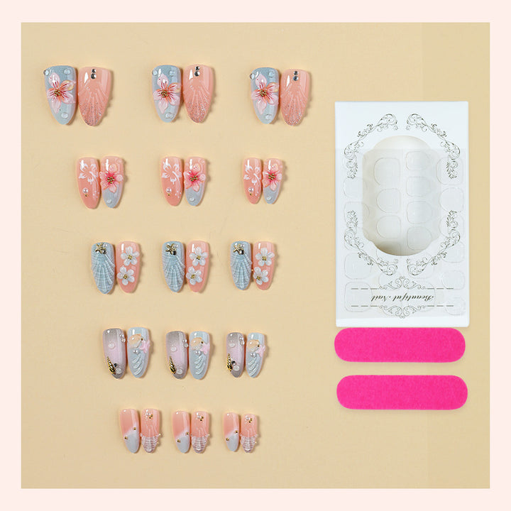 Artificial nail set with maritime motifs and colorful flowers Bowlift