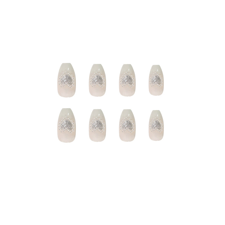 Artificial nail art with heart and rhinestone decorations Bowlift