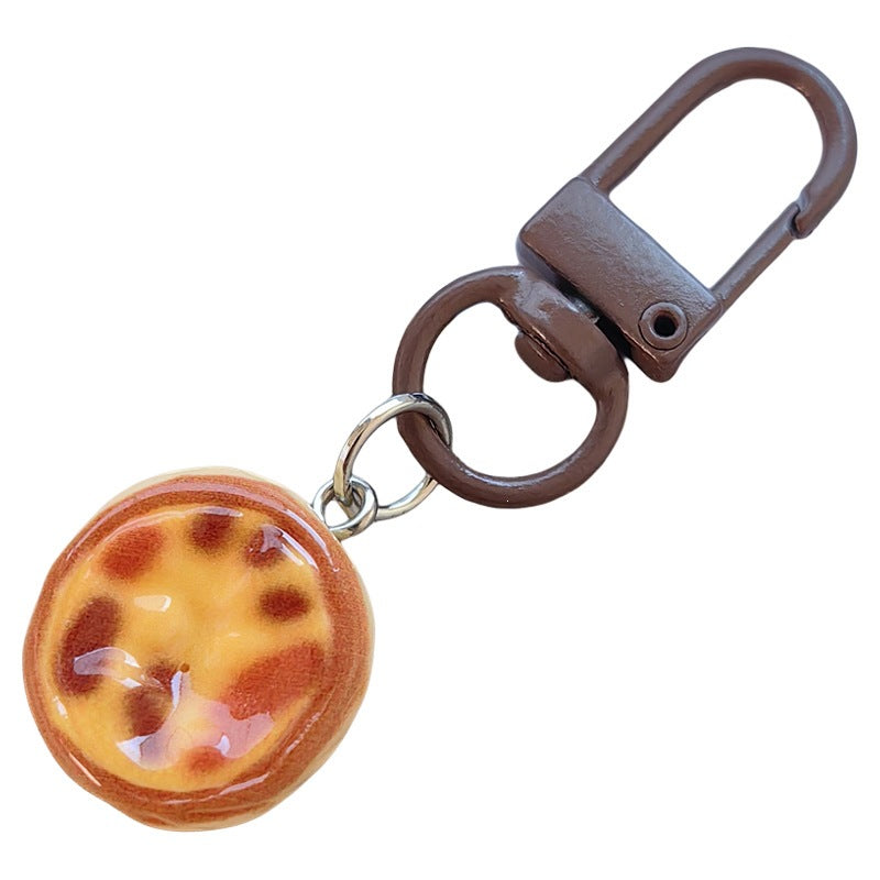 Keychain with cute cake design Bowlift