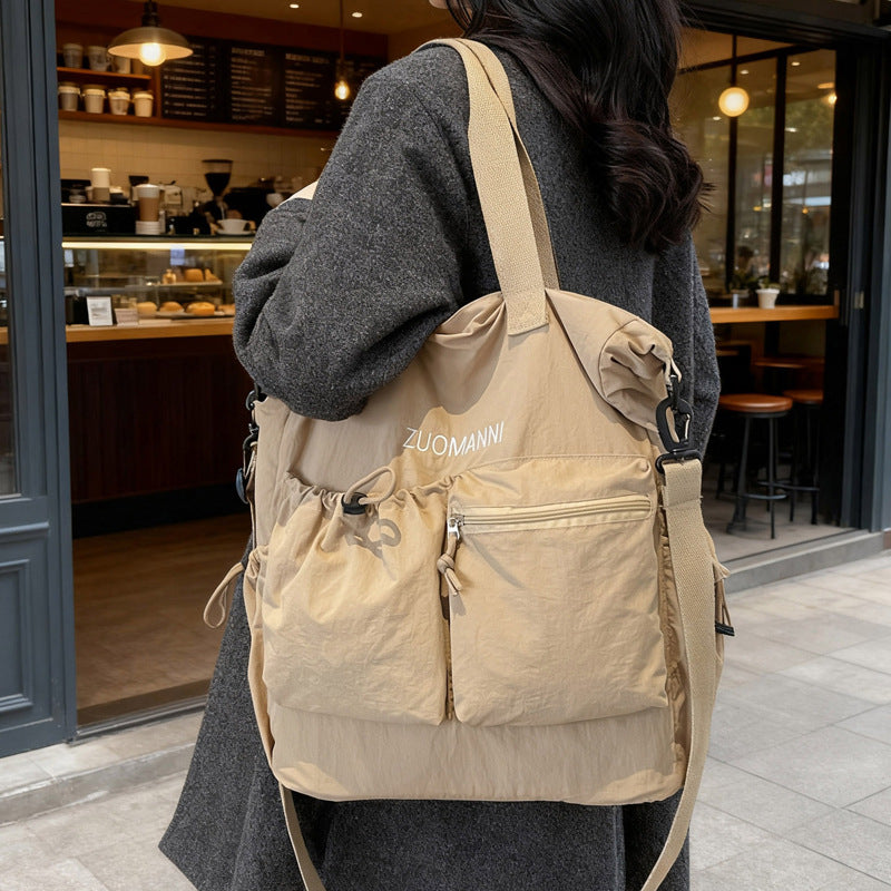 Tote bag with multifunctional outer pockets and adjustable shoulder strap Bowlift