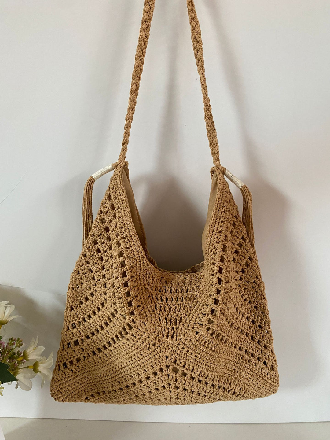 Hand-knotted shoulder bag with tassels and spacious interior Bowlift