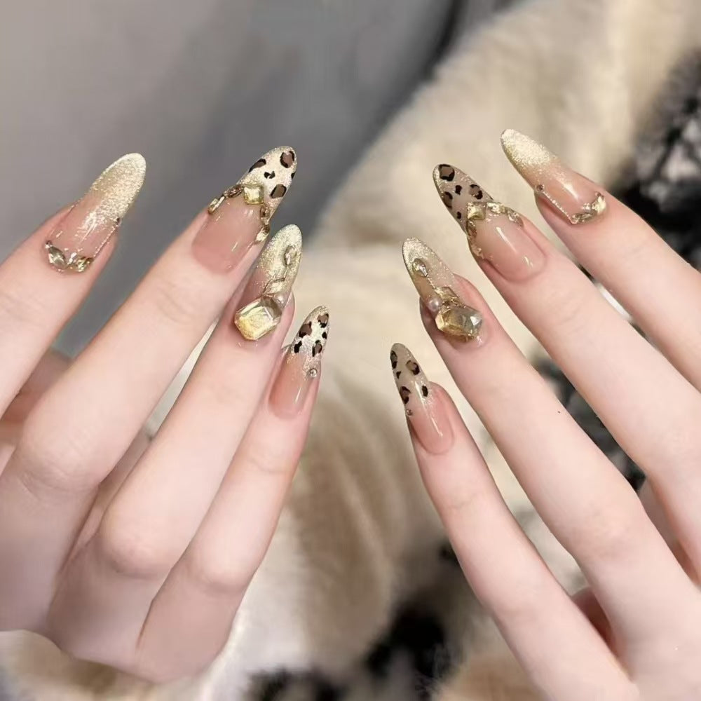 Glamorous artificial nails with elegant glitter accents and leopard details Bowlift