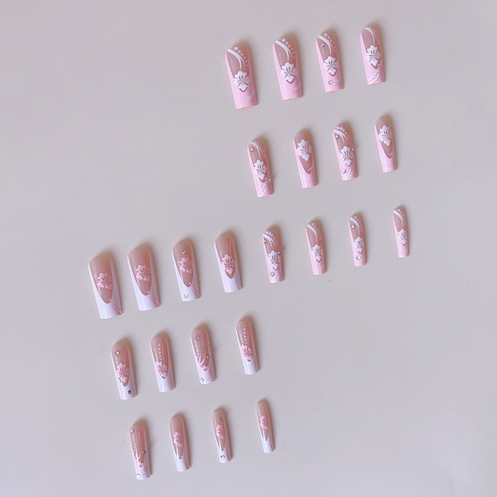 Art nail set with elegant flower design and crystal embellishments Bowlift