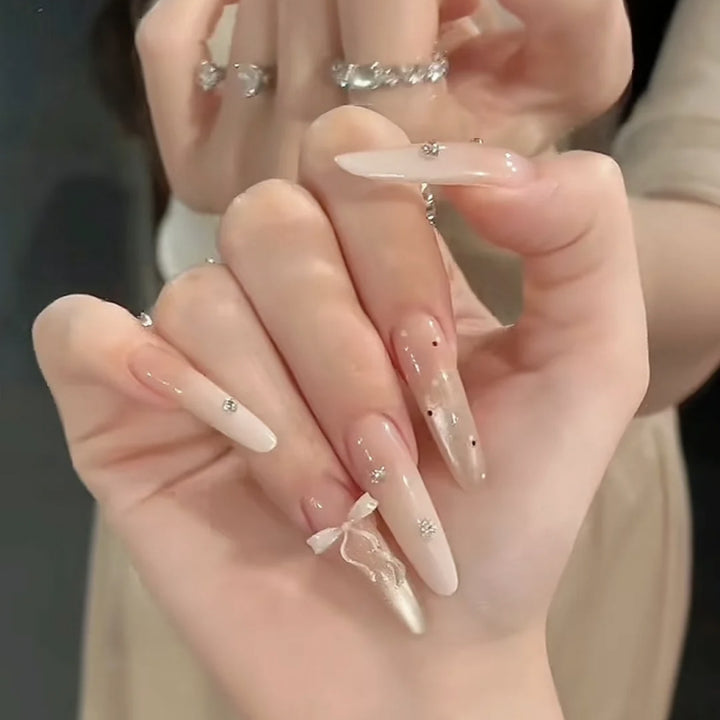 Artificial nails with elegant ombre design and delicate accents Bowlift