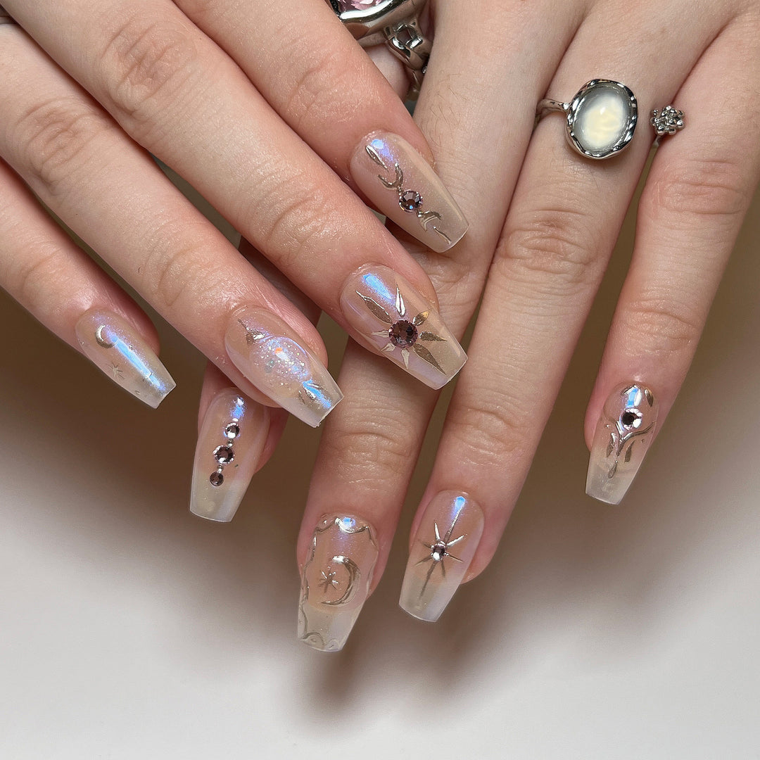 Artificial nail art with elegant rhinestone and glitter effects Bowlift