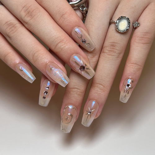 Artificial nail art with elegant rhinestone and glitter effects Bowlift