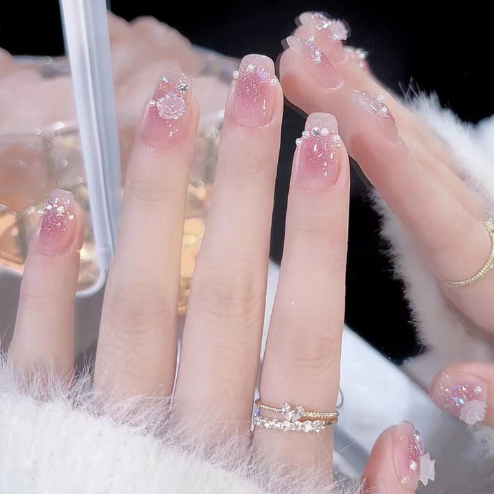 Glamorous nail art with rhinestone and pearl accents Bowlift