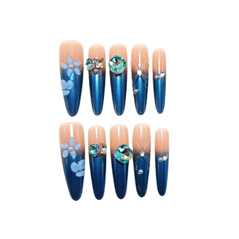 Artificial nails in elegant design with artistic decorations and glitter accents Bowlift