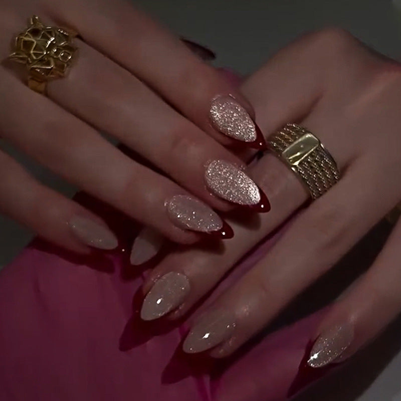 Artificial stiletto nails with sparkling tips Bowlift