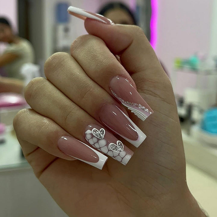 Artful Nail Extensions with Heart Design and Glitter Accents Bowlift