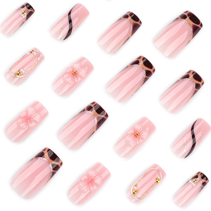 Artificial nail art with flower and glitter effects Bowlift