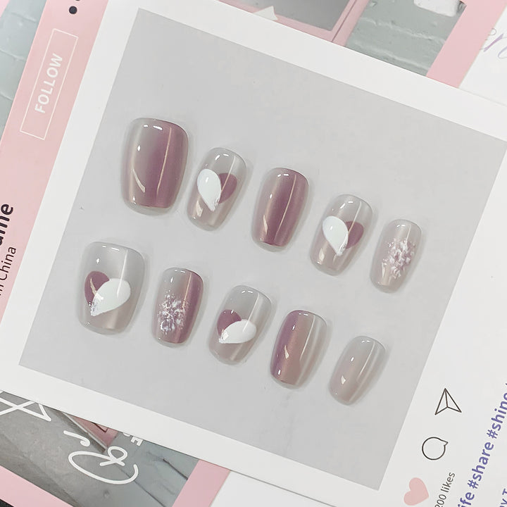 Artistic acrylic nails with heart-shaped accents Bowlift