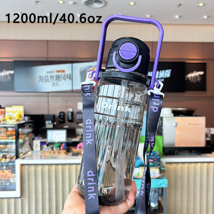 Women's large transparent drinking bottle with integrated carrying handle Bowlift