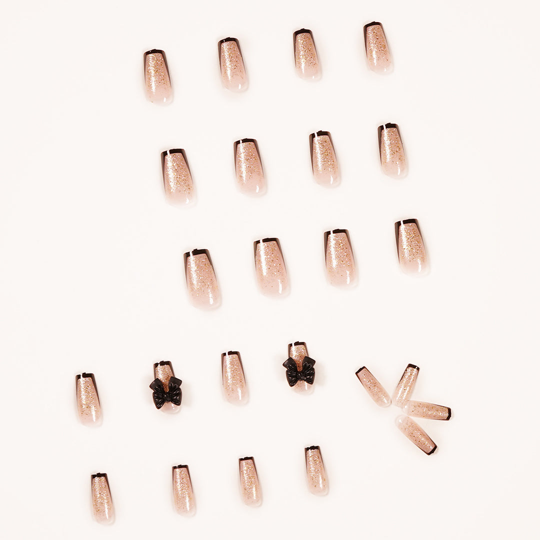Artistic Nail Extensions with Glitter and Bow Accents Bowlift