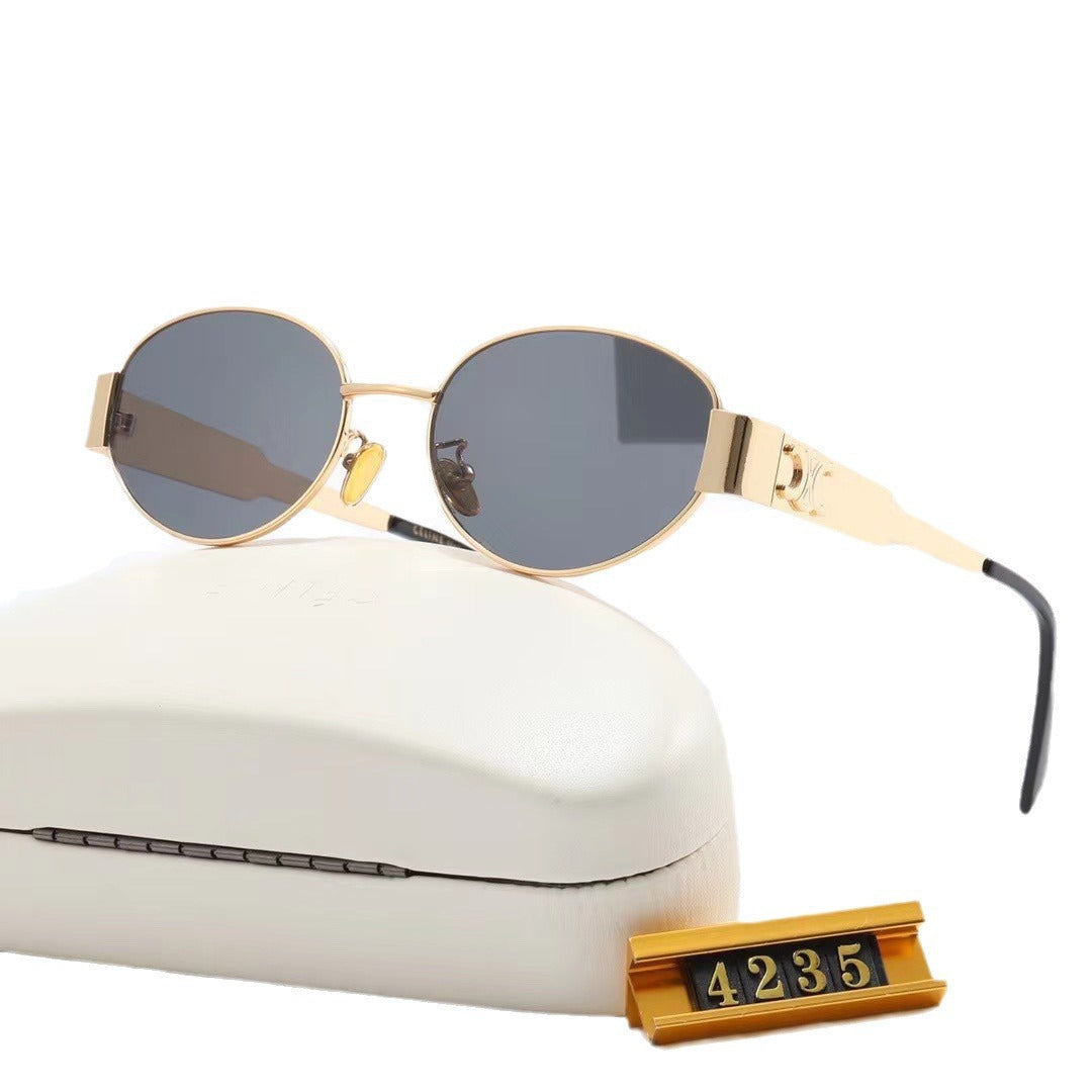 Women elegant oval sunglasses with gold-colored frame Bowlift