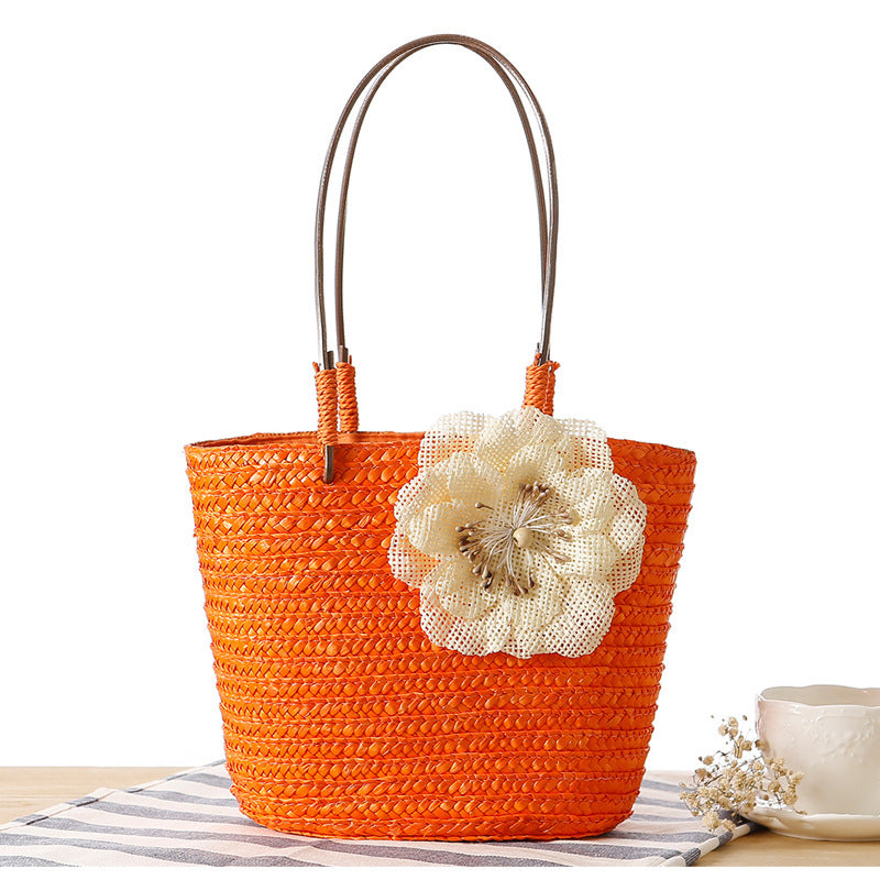 Beach bag with decorative flower detail embellishment Bowlift
