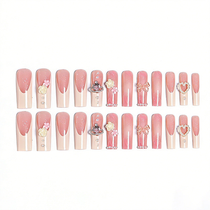Artful nail tips with pearl and bow motifs Bowlift