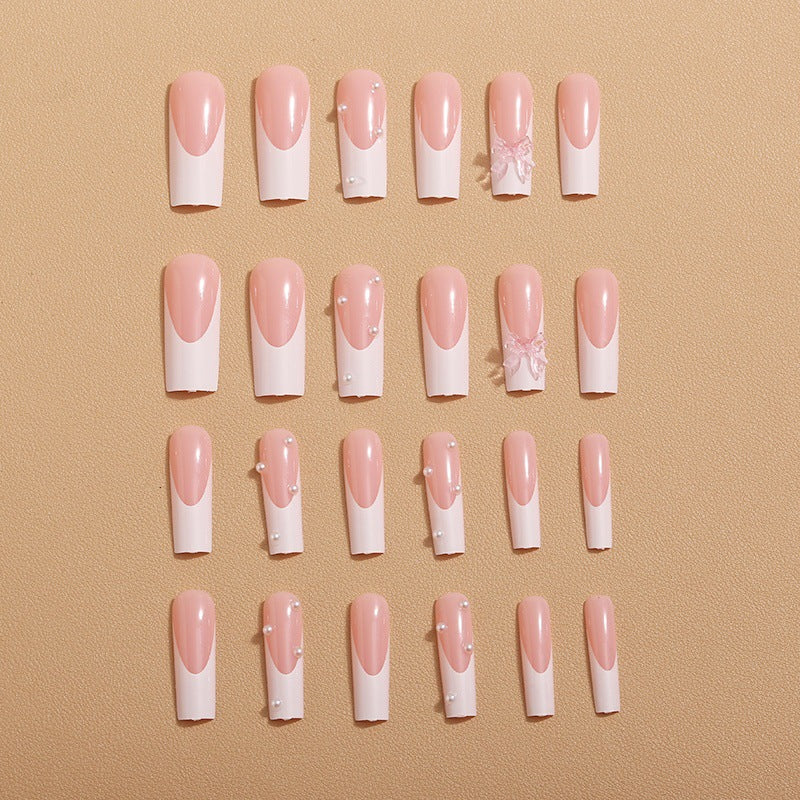 Artistic nail extensions with pearls and bows decorations Bowlift