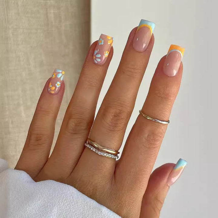 Nail art set with creative floral designs and elegant French finish Bowlift