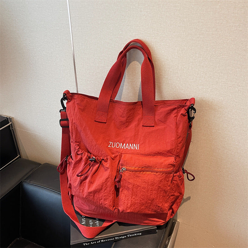 Tote bag with multifunctional outer pockets and adjustable shoulder strap Bowlift