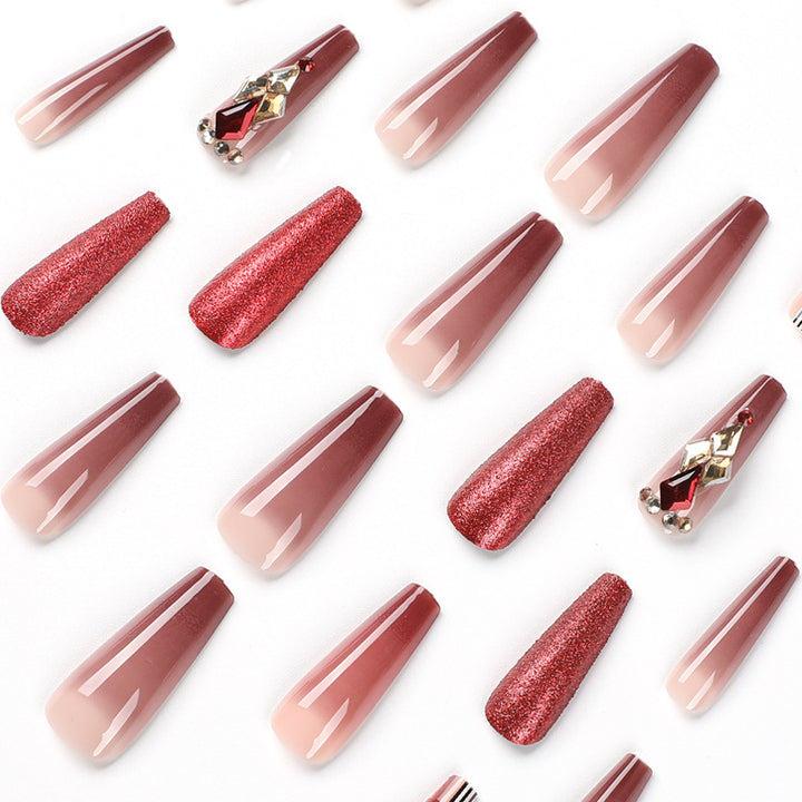 Glamorous stiletto nails with extravagant design and glitter accents Bowlift