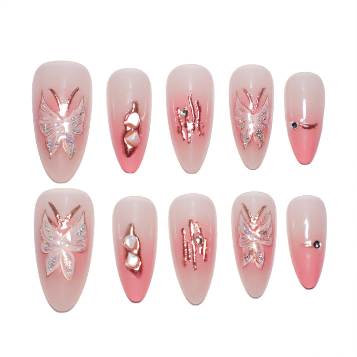 Artificial nail extensions with floral motifs and glitter accents Bowlift