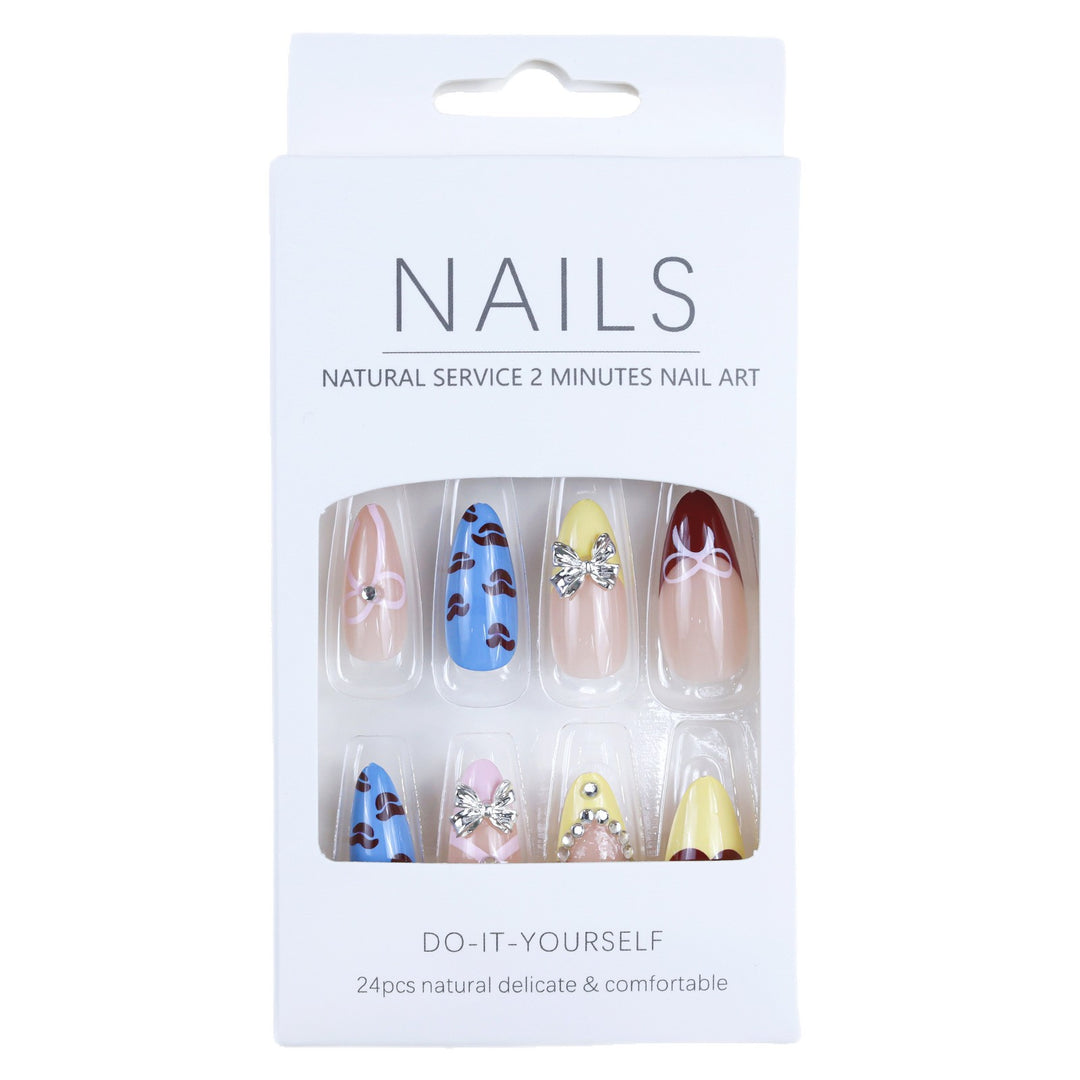 Artificial nails with playful design and 3D embellishments Bowlift