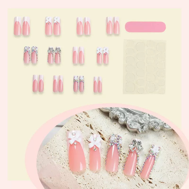 Artificial nail set with shimmering rhinestone decorations and floral design Bowlift