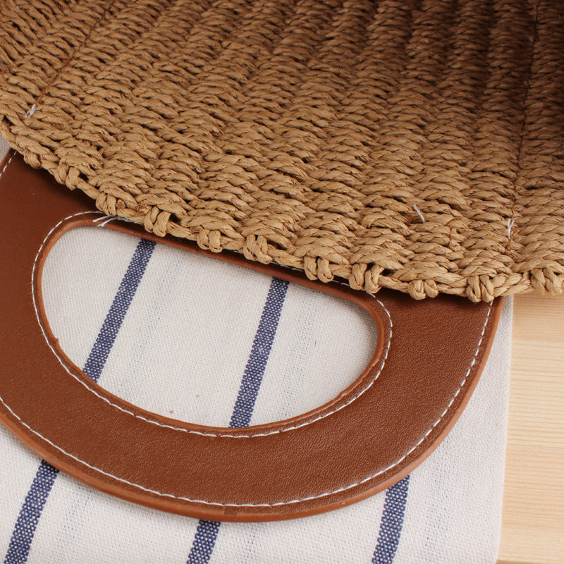 Tote bag made of braided natural material with elegant leather back Bowlift