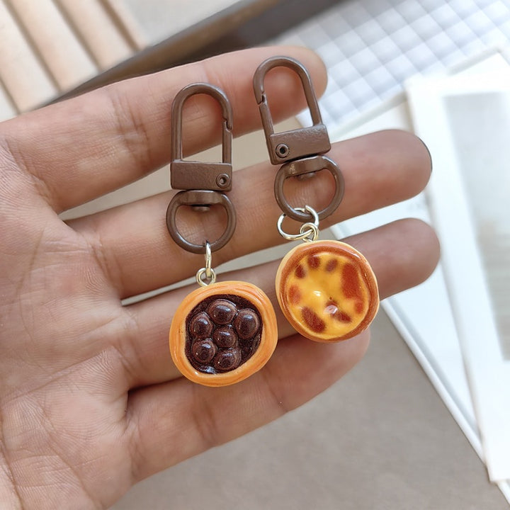 Keychain with cute cake design Bowlift