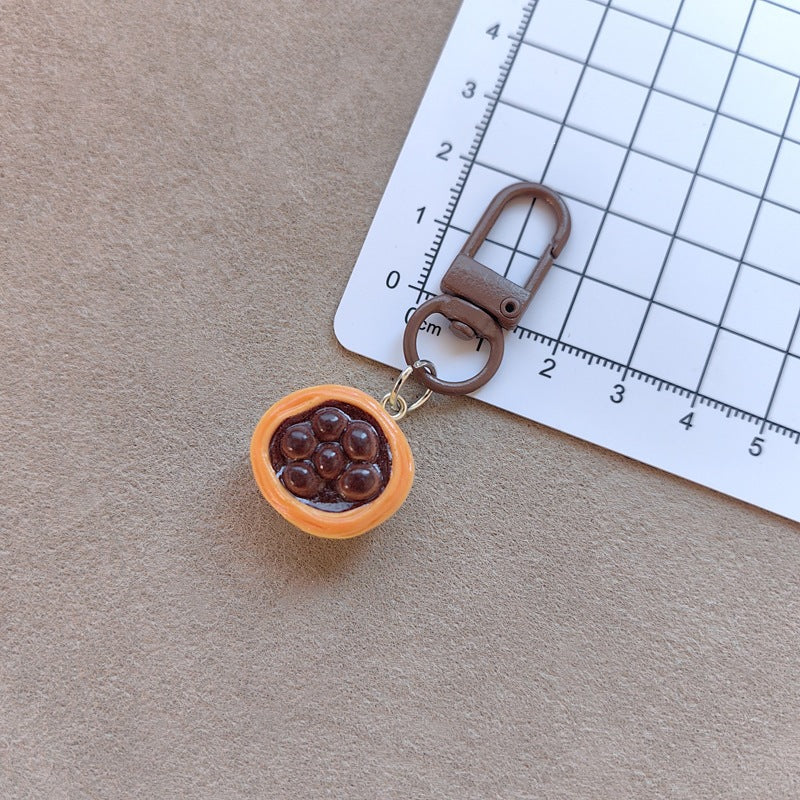 Keychain with cute cake design Bowlift