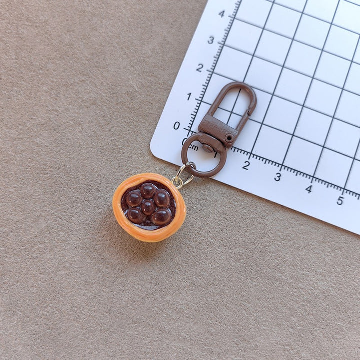 Keychain with cute cake design Bowlift