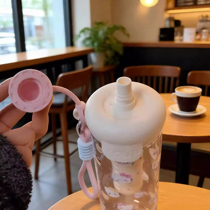 Women's water bottle with cheerful design and practical carrying handle Bowlift
