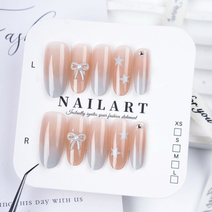 Artificial nails with elegant ombre effect and decorative accents Bowlift