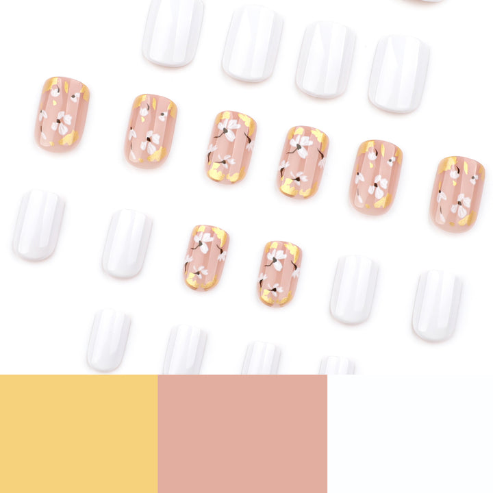 Artificial nail art with delicate flowers and glitter accents Bowlift