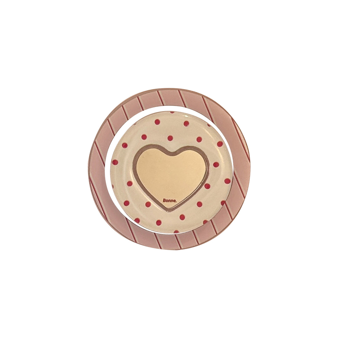 Heart-shaped coaster with playful design Bowlift