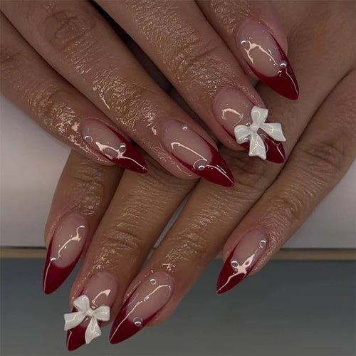 Artificial nail set with elegant bows and glitter accents Bowlift