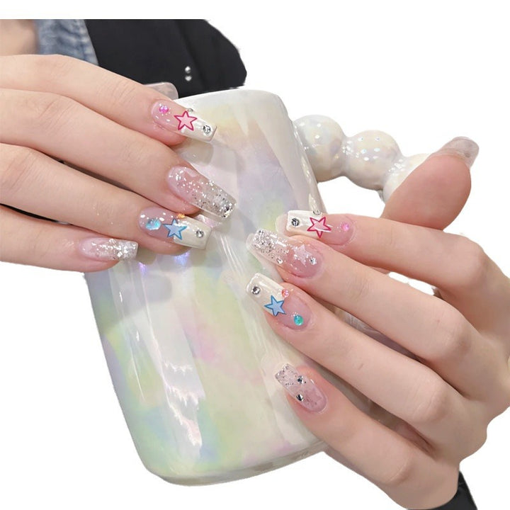 Glamorous artificial nails with heart accents Bowlift