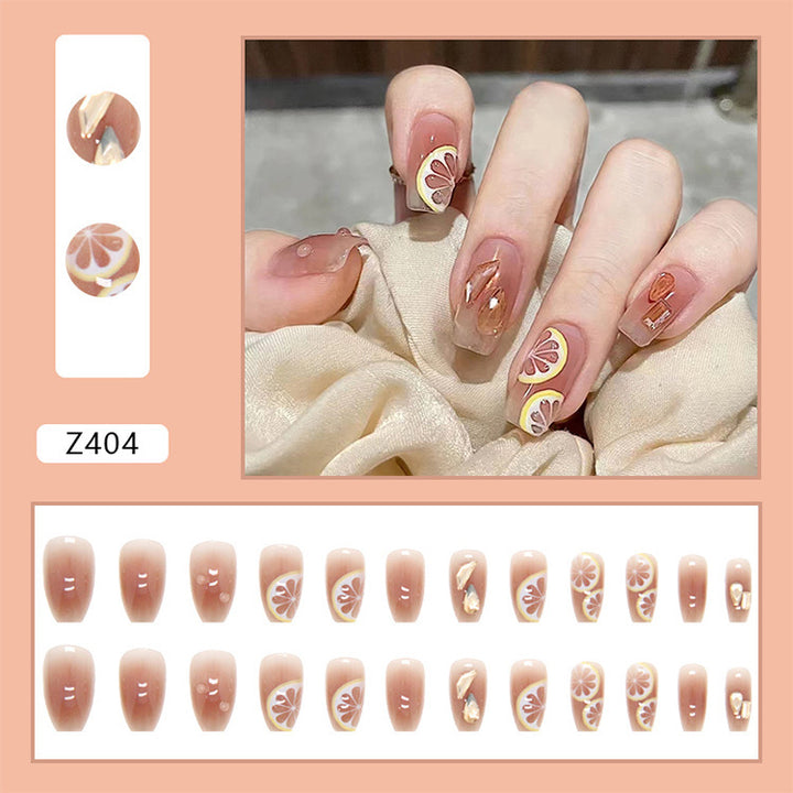 Artificial nail set with cheerful citrus motifs and elegant designs Bowlift