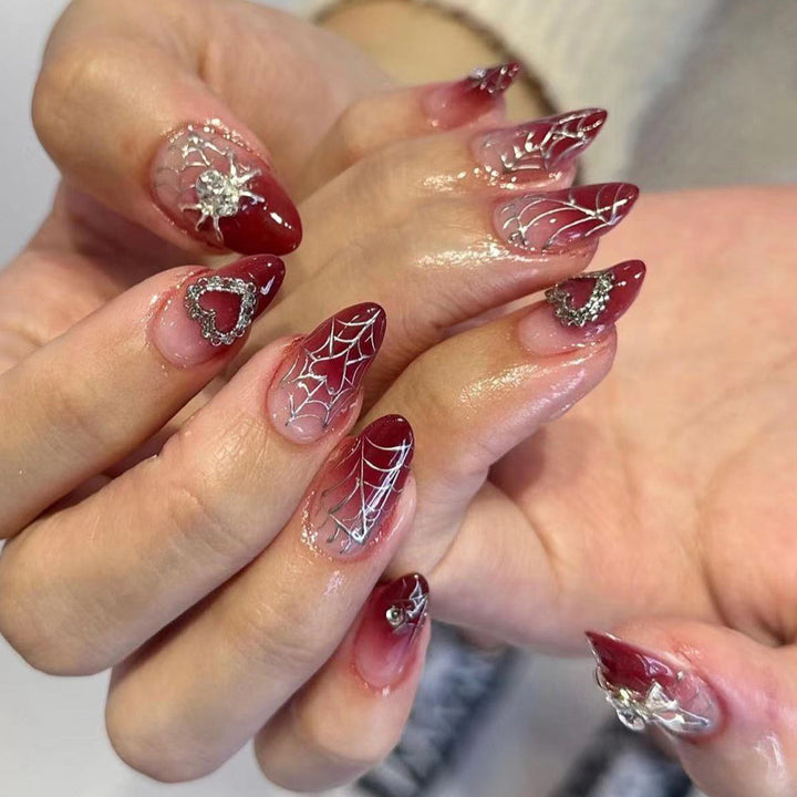 Nail art set with filigree spider web design and glitter accents Bowlift