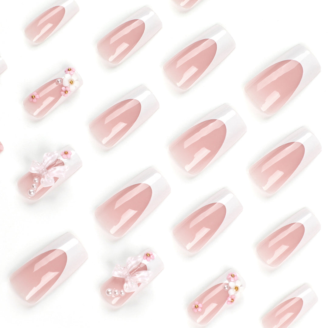 Artificial nail extensions with floral accents Bowlift