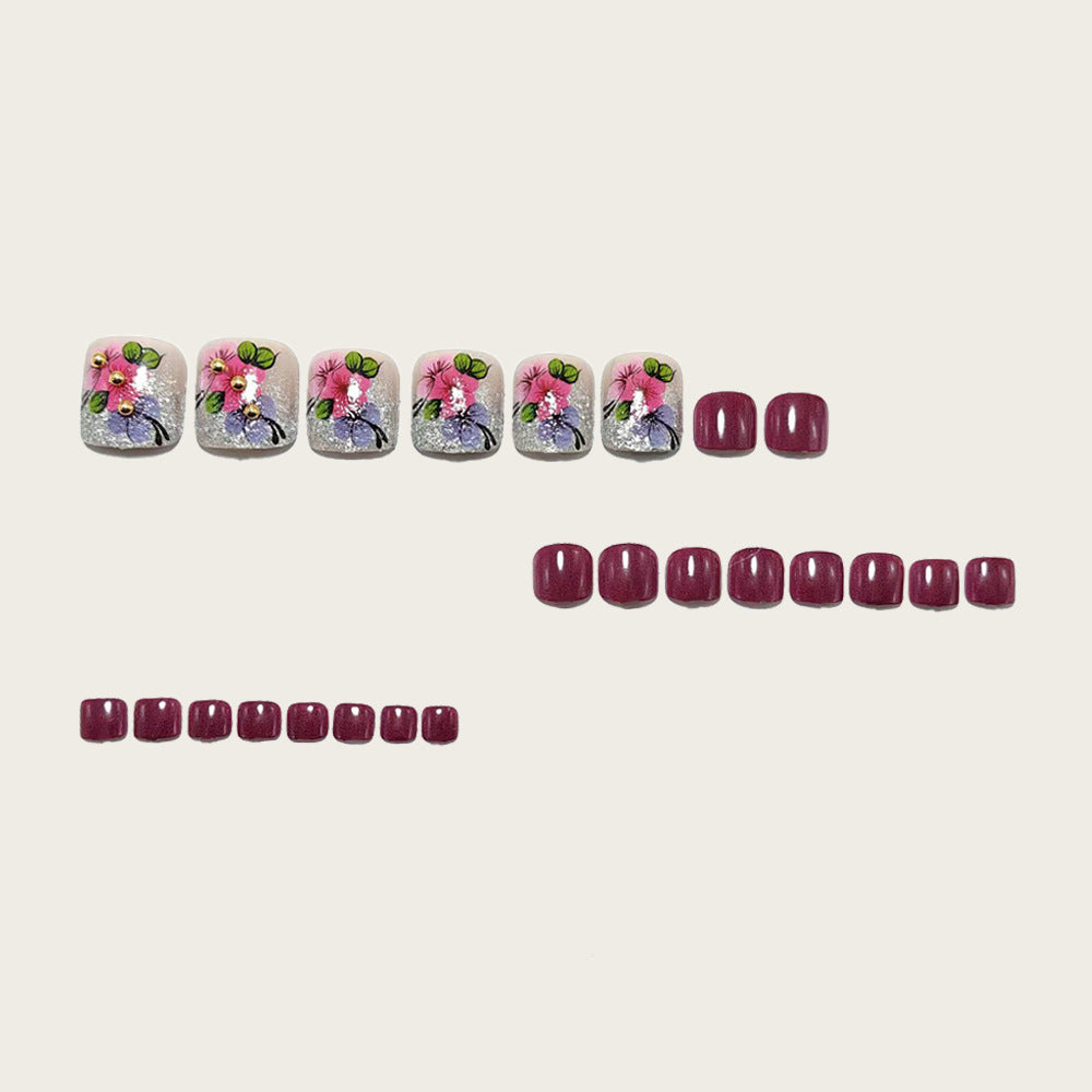 Artificial nails with floral designs and glitter effects Bowlift
